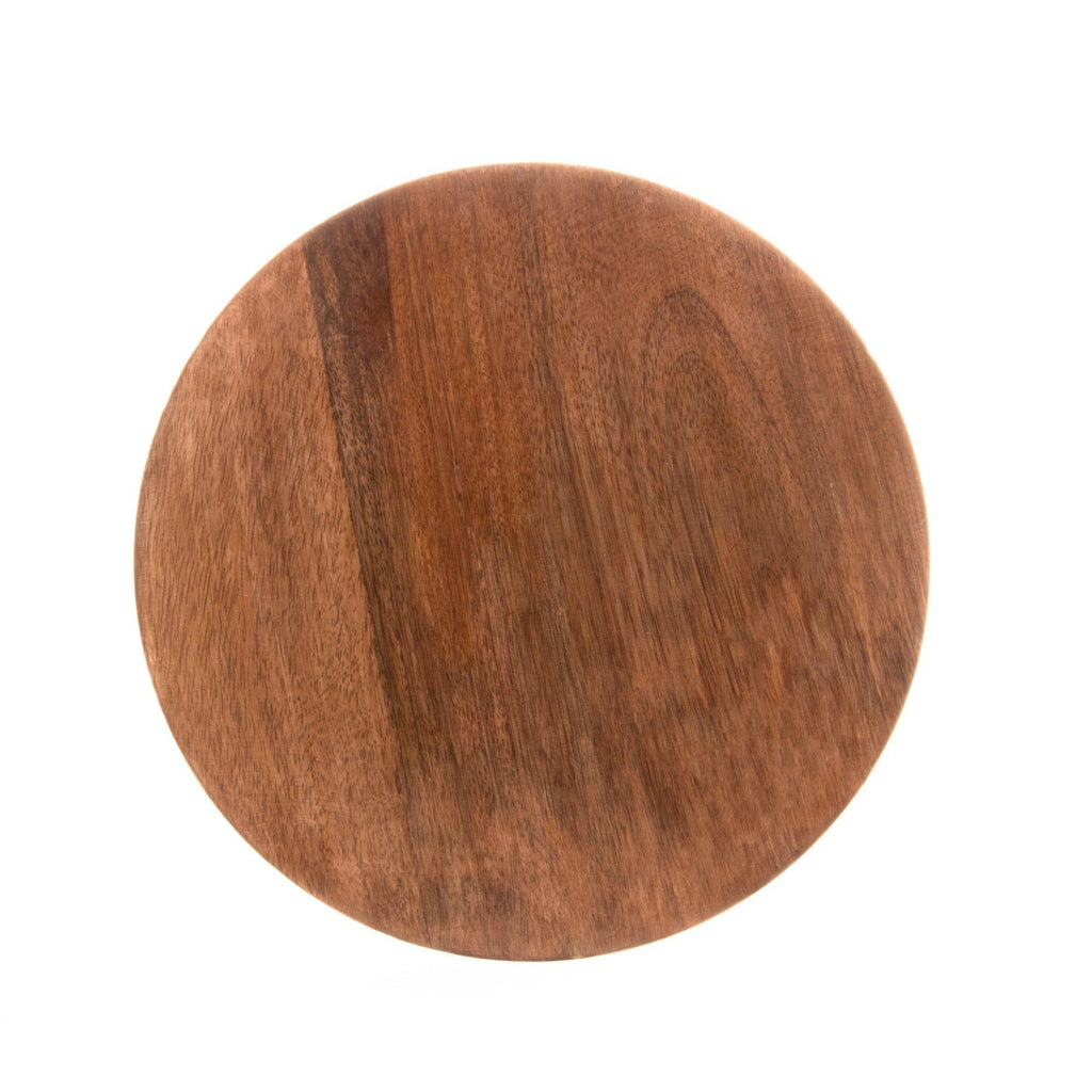 Round wooden cutting board on a white background